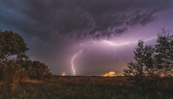 An iconic lightning framed by a bold sunset outdoors