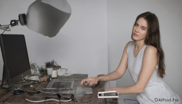 1girl,solo,long hair,looking at viewer,brown hair,dress,bare shoulders,brown eyes,sitting,closed mouth,sleeveless,indoors,white dress,cup,lips,sleeveless dress,table,plant,freckles,realistic,potted plant,lamp,cable,computer,monitor,keyboard (computer),mouse (computer),science fiction