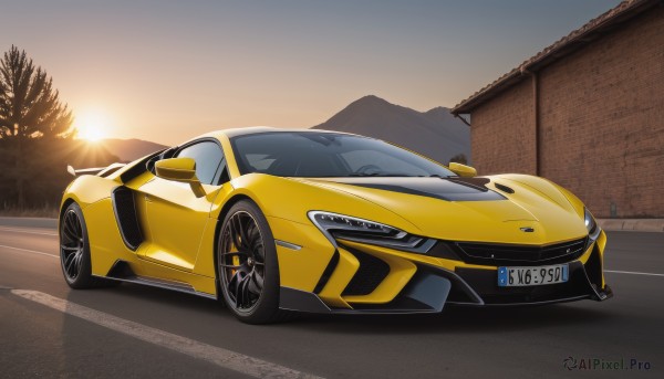 A vivid sunset outdoors highlighting a motor vehicle