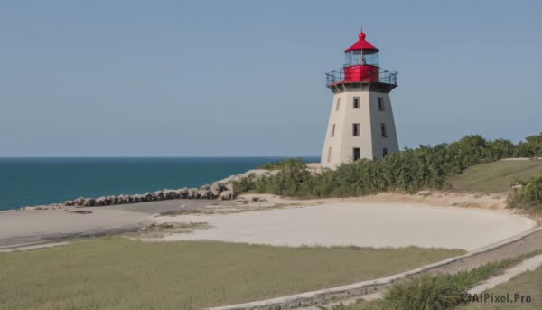 outdoors,sky,day,water,tree,blue sky,no humans,ocean,beach,grass,building,nature,scenery,sand,horizon,road,house,river,shore,path,rock,bush,tower,lighthouse