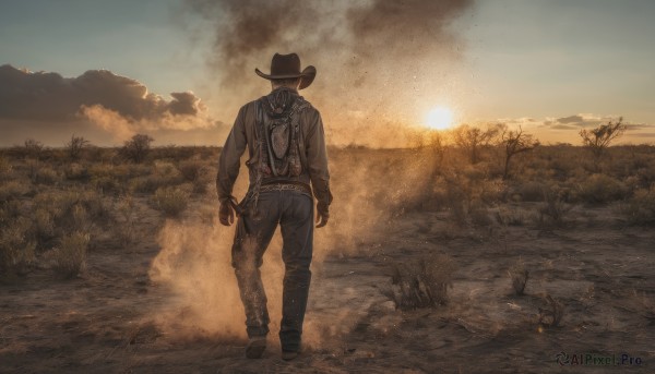 A male framed by the beauty of a lush sunset outdoors