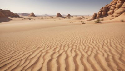 outdoors,sky,day,blue sky,no humans,beach,scenery,rock,mountain,sand,landscape,desert