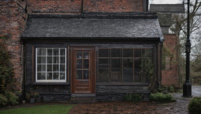 outdoors,day,tree,no humans,window,grass,plant,building,scenery,snow,fence,door,road,bush,wall,house,brick wall,lamppost,bare tree,rain,potted plant,brick