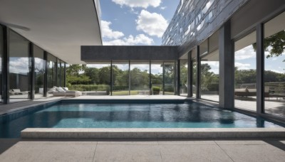 outdoors,sky,day,cloud,water,tree,blue sky,no humans,window,shadow,cloudy sky,building,scenery,reflection,fence,pool,bench,bush,reflective water,indoors