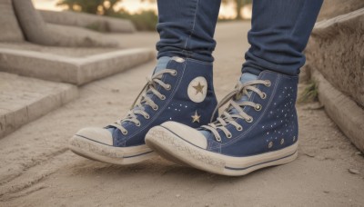 solo,1boy,male focus,outdoors,shoes,pants,artist name,star (symbol),blurry,depth of field,blurry background,shadow,denim,sneakers,close-up,out of frame,blue footwear,jeans,blue pants,road,star print,photo background,nike,cross-laced footwear