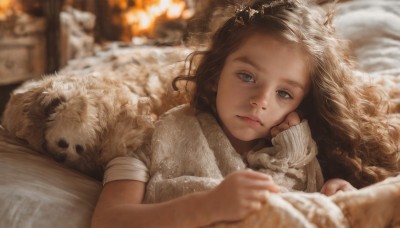 1girl,solo,long hair,looking at viewer,blue eyes,brown hair,hair ornament,closed mouth,braid,short sleeves,lying,indoors,blurry,sweater,lips,sleeves past wrists,pillow,grey eyes,bed,depth of field,blurry background,bed sheet,animal,on bed,wavy hair,on stomach,freckles,curly hair,dog,head rest,realistic,nose,blanket,under covers,tiara