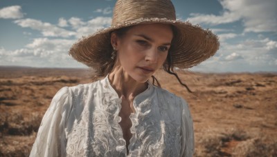 1girl,solo,long hair,looking at viewer,shirt,black hair,hat,brown eyes,jewelry,closed mouth,white shirt,upper body,earrings,outdoors,sky,day,cloud,blurry,blue sky,lips,blurry background,freckles,realistic,brown headwear,straw hat,desert,brown hair,thick eyebrows,cloudy sky