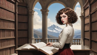 1girl,solo,breasts,looking at viewer,short hair,skirt,brown hair,shirt,long sleeves,holding,brown eyes,white shirt,pleated skirt,parted lips,sky,day,cloud,indoors,from side,blue sky,lips,looking to the side,book,window,makeup,red skirt,table,lipstick,holding book,curly hair,mountain,open book,bookshelf,red lips,library,blush,looking back,pillar