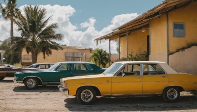 outdoors,sky,day,cloud,tree,blue sky,no humans,window,shadow,cloudy sky,ground vehicle,building,scenery,motor vehicle,palm tree,car,road,house,vehicle focus,truck,realistic,bush,lamppost