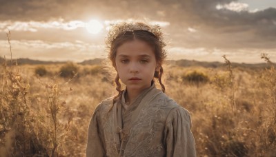 1girl,solo,long hair,looking at viewer,brown hair,brown eyes,closed mouth,upper body,braid,outdoors,sky,day,cloud,blurry,twin braids,tree,lips,depth of field,blurry background,chinese clothes,cloudy sky,freckles,mountain,realistic,sun,field,wheat,parted lips,sunlight,scenery