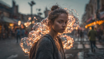 1girl, looking at viewer, short hair, blue eyes, brown hair, jewelry, closed mouth, jacket, upper body, outdoors, solo focus, necklace, bag, hair bun, blurry, lips, depth of field, blurry background, single hair bun, backpack, freckles, realistic