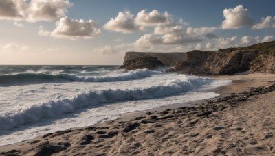 outdoors,sky,day,cloud,water,blue sky,no humans,ocean,beach,cloudy sky,nature,scenery,mountain,sand,horizon,waves,landscape,shore,rock,desert