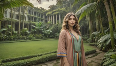 1girl,solo,long hair,breasts,looking at viewer,smile,blue eyes,brown hair,long sleeves,dress,cleavage,brown eyes,jewelry,medium breasts,standing,outdoors,day,wide sleeves,necklace,tree,lips,wavy hair,grass,plant,building,nature,scenery,forest,realistic,blonde hair,palm tree,ruins,overgrown