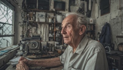 solo,looking at viewer,blue eyes,shirt,1boy,holding,closed mouth,white shirt,upper body,white hair,short sleeves,grey hair,male focus,collared shirt,indoors,blurry,window,depth of field,blurry background,facial hair,chair,paper,realistic,camera,old,old man,office,wrinkled skin,short hair,lamp