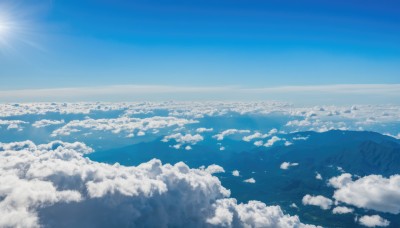 monochrome,outdoors,sky,day,cloud,water,blue sky,no humans,ocean,sunlight,cloudy sky,scenery,blue theme,mountain,sun,horizon,landscape,above clouds,nature