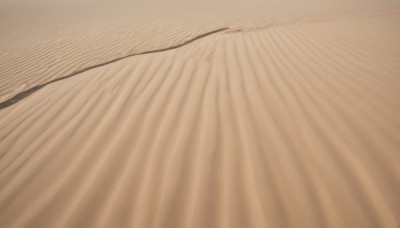 solo,outdoors,sky,no humans,scenery,sand,desert,male focus,lying,bed sheet,close-up,sepia,brown theme