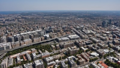 outdoors,sky,day,water,tree,blue sky,no humans,ocean,from above,building,scenery,city,horizon,cityscape,river,landscape,town,real world location,cloud,road,skyscraper