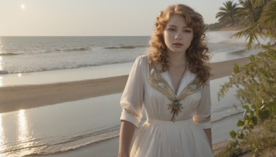 1girl,solo,long hair,breasts,looking at viewer,brown hair,dress,brown eyes,jewelry,standing,upper body,short sleeves,outdoors,parted lips,day,water,necklace,white dress,tree,lips,ocean,wavy hair,beach,sunlight,plant,backlighting,curly hair,realistic,arms at sides,shore,earrings,scenery