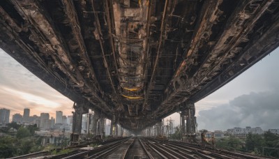 outdoors,sky,day,cloud,tree,no humans,sunlight,cloudy sky,grass,ground vehicle,building,scenery,science fiction,city,road,cityscape,ruins,bridge,skyscraper,railroad tracks,post-apocalypse,stairs,railing,landscape