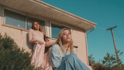 long hair,looking at viewer,blue eyes,multiple girls,skirt,blonde hair,brown hair,shirt,long sleeves,dress,2girls,brown eyes,sitting,white shirt,outdoors,parted lips,sky,sleeveless,day,white dress,tree,blue sky,lips,blue skirt,sleeveless dress,looking up,plant,building,long skirt,realistic,house,power lines,utility pole,jewelry,earrings,necklace,window,chair,looking away,denim