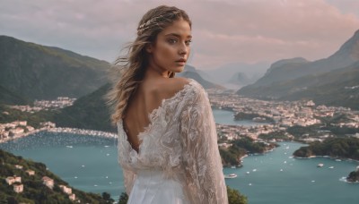 1girl,solo,long hair,looking at viewer,brown hair,long sleeves,dress,bare shoulders,brown eyes,upper body,braid,outdoors,sky,looking back,cloud,dark skin,water,from behind,white dress,dark-skinned female,lips,back,scenery,mountain,backless outfit,realistic,backless dress,river,landscape,mountainous horizon,lake,blonde hair,parted lips,tree,cloudy sky,wind