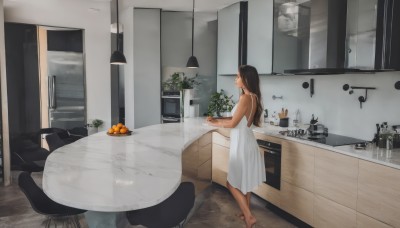 1girl,solo,long hair,brown hair,black hair,dress,holding,bare shoulders,standing,food,barefoot,sleeveless,indoors,dark skin,white dress,from side,dark-skinned female,cup,bare arms,window,fruit,sleeveless dress,chair,table,plant,scenery,plate,bowl,wooden floor,tiles,potted plant,wide shot,orange (fruit),kitchen,sink,refrigerator,cabinet,stove,cutting board,smile,profile,realistic