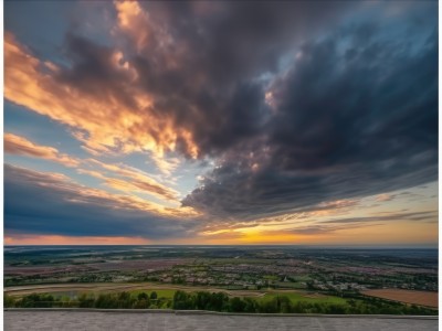 outdoors,sky,cloud,tree,blue sky,no humans,border,sunlight,cloudy sky,grass,building,nature,scenery,sunset,mountain,city,horizon,road,cityscape,field,river,landscape,hill,day,ocean,forest