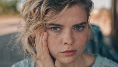 1girl,solo,looking at viewer,short hair,blue eyes,blonde hair,brown hair,shirt,parted lips,solo focus,blurry,lips,depth of field,blurry background,pov,portrait,close-up,hand on own face,freckles,hand in own hair,realistic,nose,pov hands,hand on another's face,black hair,closed mouth,lying,barefoot,artist name,eyelashes,blue shirt,on stomach