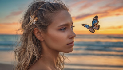 1girl, solo, long hair, brown hair, hair ornament, flower, outdoors, sky, hair flower, blurry, lips, profile, ocean, beach, bug, butterfly, portrait, sunset, realistic, nose, blue butterfly