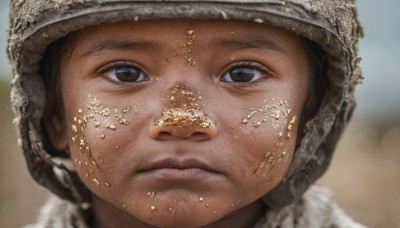 solo,looking at viewer,brown hair,black hair,1boy,hat,brown eyes,closed mouth,male focus,outdoors,blurry,lips,depth of field,blurry background,portrait,close-up,realistic,male child,dirty,dirty face,1girl,helmet