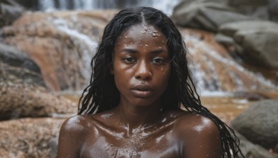 1girl,solo,long hair,looking at viewer,black hair,brown eyes,collarbone,upper body,nude,parted lips,dark skin,water,blurry,black eyes,dark-skinned female,lips,wet,blurry background,portrait,forehead,rock,realistic,wet hair,very dark skin,bare shoulders,closed mouth,shiny,shiny skin,depth of field