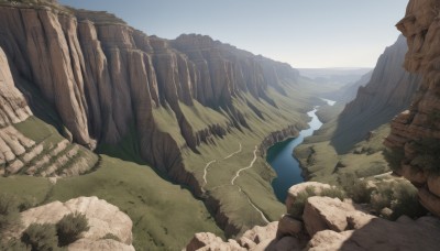 outdoors,sky,day,water,tree,no humans,grass,nature,scenery,rock,mountain,river,landscape,cliff,blue sky,horizon,lake,shore