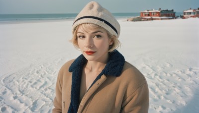 1girl,solo,looking at viewer,smile,short hair,blonde hair,hat,closed mouth,jacket,upper body,outdoors,day,scarf,black eyes,lips,coat,ocean,white headwear,beach,snow,realistic,beanie,winter clothes,red lips,watercraft,blue scarf,brown coat,boat,photo background,bangs,blue eyes,jewelry,earrings,makeup,lipstick,stud earrings,winter