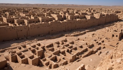 monochrome,outdoors,sky,day,cloud,water,no humans,ocean,building,scenery,city,sand,horizon,cityscape,river,landscape,brown theme,desert,blue sky,rock,ruins,sepia,shore