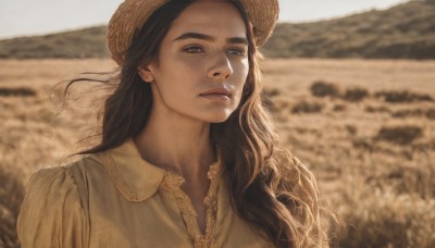 1girl,solo,long hair,looking at viewer,brown hair,shirt,black hair,hat,brown eyes,closed mouth,white shirt,upper body,outdoors,day,collared shirt,blurry,lips,depth of field,blurry background,portrait,freckles,realistic,nose,brown headwear,straw hat,field,sunlight,thick eyebrows,messy hair,sand,sepia,brown theme,mole on cheek