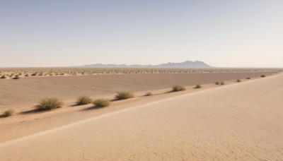 outdoors,sky,day,tree,blue sky,no humans,grass,nature,scenery,mountain,sand,road,field,landscape,mountainous horizon,gradient sky,desert,water,ocean,beach,horizon,waves,shore