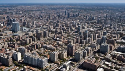 outdoors,sky,no humans,from above,building,scenery,city,cityscape,skyscraper,landscape,rooftop,day,tree,blue sky,ocean,horizon,river,real world location