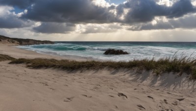 outdoors,sky,day,cloud,water,blue sky,no humans,shadow,ocean,beach,cloudy sky,grass,scenery,rock,sand,horizon,waves,shore,sunlight,landscape,footprints