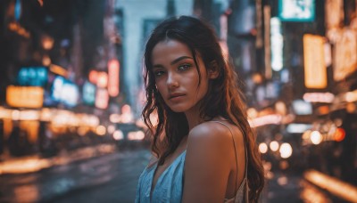 1girl,solo,long hair,breasts,looking at viewer,brown hair,black hair,dress,bare shoulders,brown eyes,upper body,outdoors,sleeveless,dark skin,blurry,dark-skinned female,lips,night,depth of field,blurry background,blue dress,wavy hair,freckles,realistic,nose,very dark skin,closed mouth,from side,thick eyebrows,bokeh