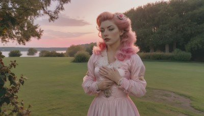 1girl,solo,long hair,hair ornament,long sleeves,dress,jewelry,pink hair,flower,earrings,outdoors,parted lips,puffy sleeves,hair flower,water,bracelet,tree,lips,looking to the side,makeup,looking away,own hands together,grass,pink dress,nature,scenery,puffy long sleeves,forest,curly hair,sunset,realistic,hands on own chest,lake,sky,cloud,rose,ring