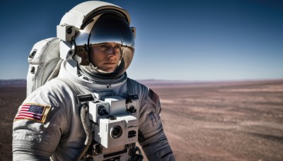 solo,1boy,upper body,male focus,outdoors,sky,day,blurry,blurry background,helmet,science fiction,realistic,american flag,spacesuit,desert,japanese flag,pilot,astronaut,looking at viewer,closed mouth,blue sky,serious,pilot suit,planet,space helmet,united states