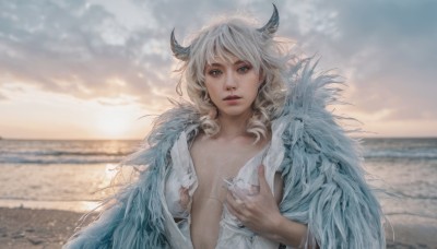 1girl,solo,long hair,breasts,looking at viewer,bangs,blue eyes,blonde hair,shirt,medium breasts,white shirt,upper body,white hair,outdoors,parted lips,open clothes,horns,sky,day,cloud,blurry,lips,torn clothes,depth of field,blurry background,ocean,beach,cloudy sky,feathers,breasts apart,curly hair,realistic,torn shirt,fingernails