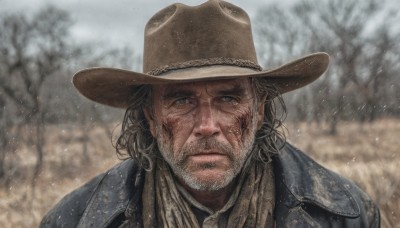 solo,looking at viewer,blue eyes,brown hair,1boy,hat,closed mouth,jacket,upper body,male focus,outdoors,medium hair,scarf,blurry,tree,blurry background,facial hair,scar,blue jacket,portrait,beard,scar on face,snowing,realistic,brown headwear,manly,cowboy hat,day,grey eyes,snow,brown jacket,serious,scar across eye,bare tree,grey sky,cowboy western