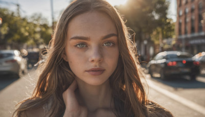 1girl, solo, long hair, looking at viewer, brown hair, brown eyes, jewelry, closed mouth, earrings, outdoors, day, mole, blurry, lips, depth of field, blurry background, thick eyebrows, ground vehicle, portrait, motor vehicle, freckles, realistic, nose, car, road, hand on own neck, mole on cheek