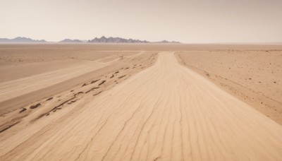 monochrome,outdoors,sky,day,no humans,ocean,beach,scenery,mountain,sand,horizon,landscape,mountainous horizon,shore,desert,water