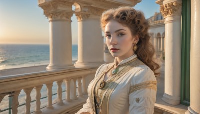 1girl,solo,long hair,breasts,looking at viewer,brown hair,shirt,long sleeves,brown eyes,jewelry,upper body,earrings,outdoors,parted lips,sky,day,water,necklace,blurry,vest,lips,makeup,blurry background,ocean,wavy hair,sunlight,brooch,gem,scenery,curly hair,railing,red lips,pillar,green gemstone,balcony,column,dress,medium breasts,closed mouth,white dress,blue sky,pendant,backlighting,sunset,realistic,nose,horizon