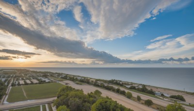 outdoors,sky,day,cloud,water,tree,blue sky,no humans,ocean,sunlight,cloudy sky,grass,building,nature,scenery,sunset,fence,horizon,road,river,landscape,hill,beach,bush,street,shore,guard rail