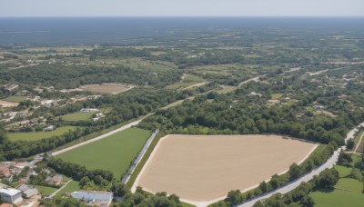 outdoors,sky,day,water,tree,blue sky,no humans,ocean,from above,beach,building,nature,scenery,mountain,city,horizon,road,cityscape,river,landscape,shore,hill,town,island,cloud,forest,bush,house