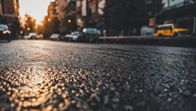 outdoors,sky,blurry,tree,no humans,depth of field,blurry background,ground vehicle,building,scenery,motor vehicle,city,sign,realistic,car,road,lamppost,street,photo background,real world location,day,window,sunlight,lens flare,sunset,bokeh,evening,sidewalk