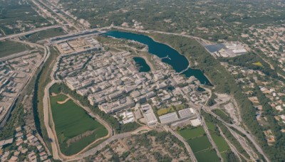 outdoors,water,tree,no humans,bird,from above,building,scenery,city,road,cityscape,watercraft,bridge,river,landscape,sky,day,ground vehicle,nature,motor vehicle,car,house,street,town,real world location